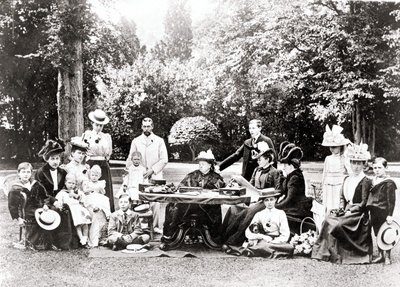 Members of the British Royal Family including King George V, King Edward VIII around Queen Victoria at a garden party by Unknown photographer