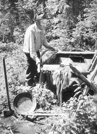 Sluicing operation and panning for gold in California late 19th century by Unknown photographer