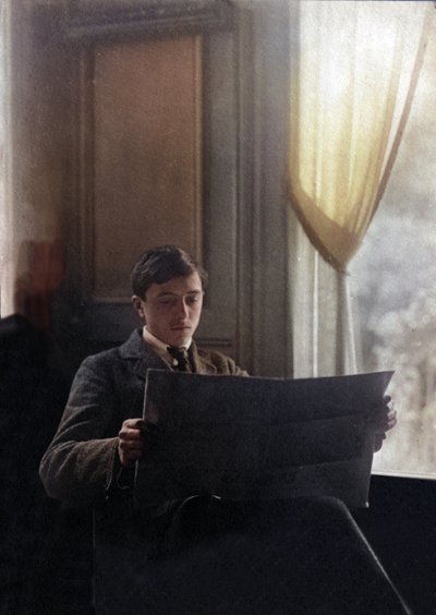 Young Man Reads the Morning Newspaper, France by Unknown photographer