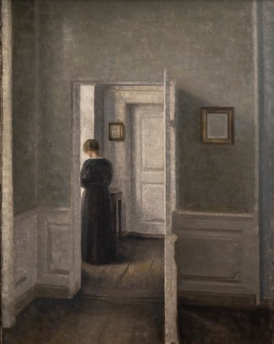 Interior with a Woman Standing by Vilhelm Hammershoi