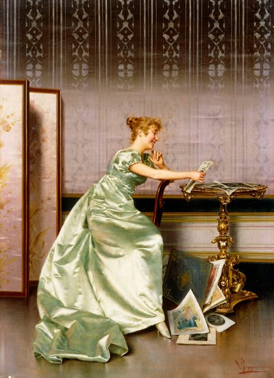 An Elegant Lady Admiring a Portfolio of Prints by Vittorio Reggianini
