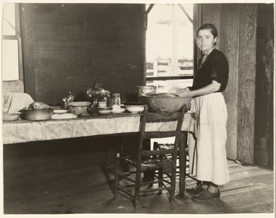 Elizabeth Tengle at the Kitchen Table / Paralee Ricketts Working in the Kitchen by Walker Evans