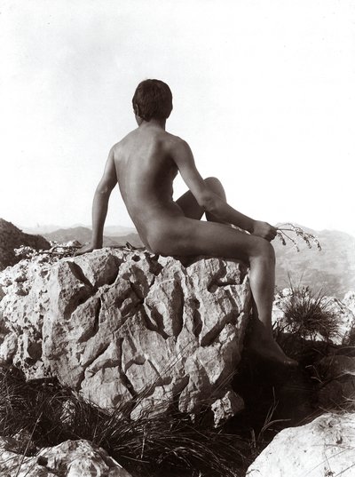 Young man posing on a rock by Wilhelm Baron von Gloeden