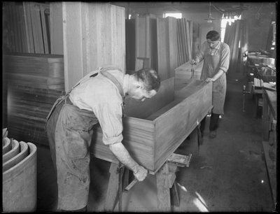 Adjusting the sides and bottom of the shell of a wooden casket, Oneida, New York, April 3, 1916 by William Davis Hassler