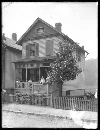 Four Children Pose on the Porch of a House on a River or Lake, Inwood, New York, c.1910 by William Davis Hassler