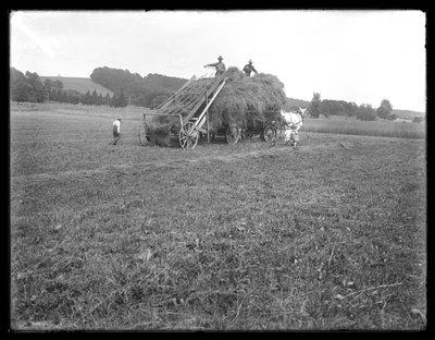 Hay wagon, farm workers and children, showing apparatus for lifting the hay, McCready Farm, Crawford County, Pennsylvania, c.1913 by William Davis Hassler