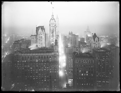 High-angle Misty Night View of Lower Manhattan Looking North, with the Singer Building, Woolworth Building, and Municipal Building Visible, c.1913 by William Davis Hassler
