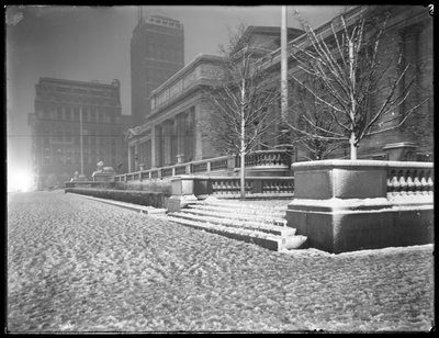 Night view of the Fifth Avenue facade of the main branch of the New York Public Library in the snow, 42nd Street and Fifth Avenue, New York City, March 6, 1915 by William Davis Hassler