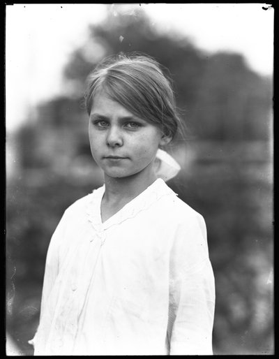 Outdoor portrait shot of an unidentified little girl in a white dress by William Davis Hassler