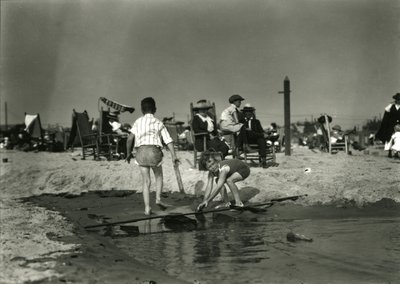 Two Children Play with Wood Scraps in Shallows, Coney Island, c.1910-21 by William Davis Hassler
