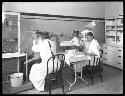 Two Patients Being Examined in the Main Hospital Examining Room, Seton Hospital, Spuyten Duyvil, Bronx, October 30, 1914 by William Davis Hassler