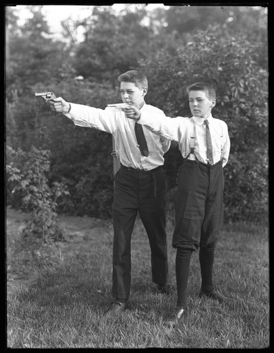 Two Unidentified Boys Pose Aiming Pistols, July 1915 by William Davis Hassler