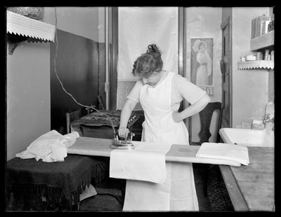 Unidentified Woman Demonstrating the Use of an Electric Iron by William Davis Hassler