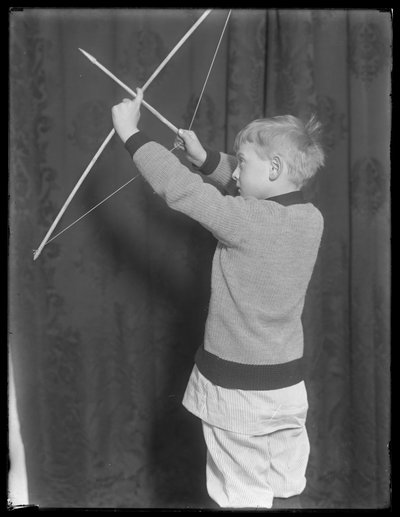 William Gray Hassler posing with bow and arrow, c.1912 by William Davis Hassler