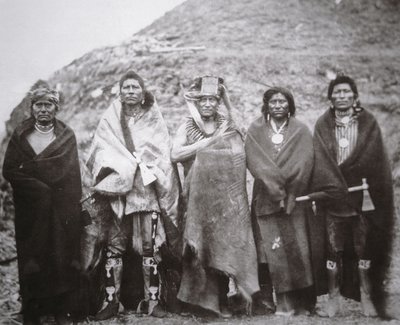 Pawnee people in front of a tribal earth lodge by William Henry Jackson