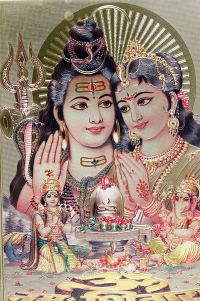 God Shiva and Goddess Parvati with their son Ganesha. by . .
