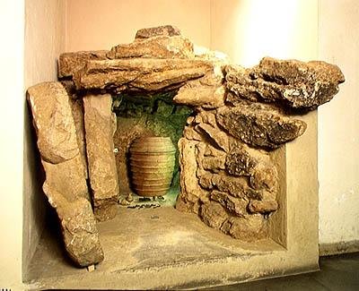 Reconstruction of an Etruscan tomb with an urn by after Etruscan