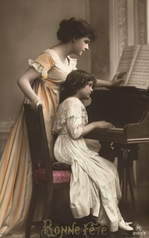 Mother and daughter at a piano by French Photographer