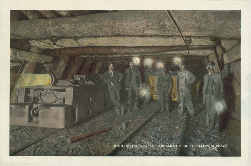 American Coal Mining: Hauling Cars by Electric Motor 1000 ft Below Surface by American Photographer