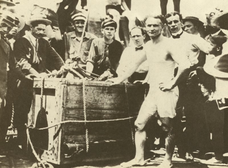 Harry Houdini being lowered into the ice-covered Detroit River in 1907 by American Photographer