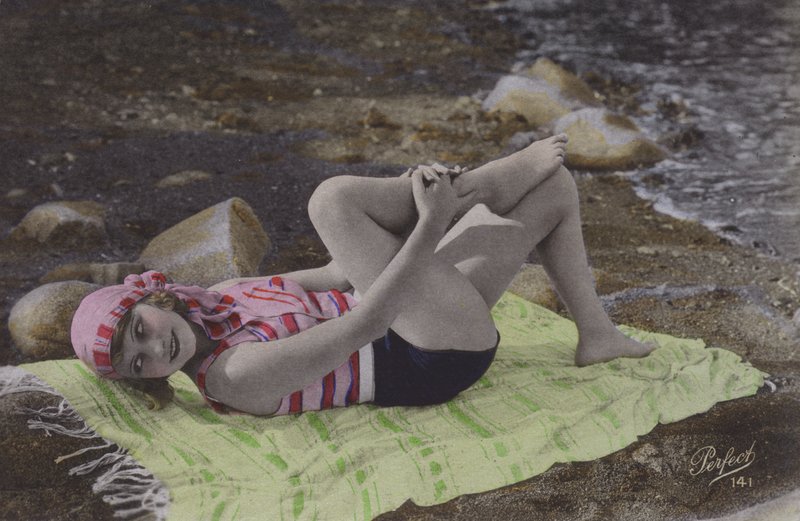 Girl Lying on Towel on Beach by English Photographer
