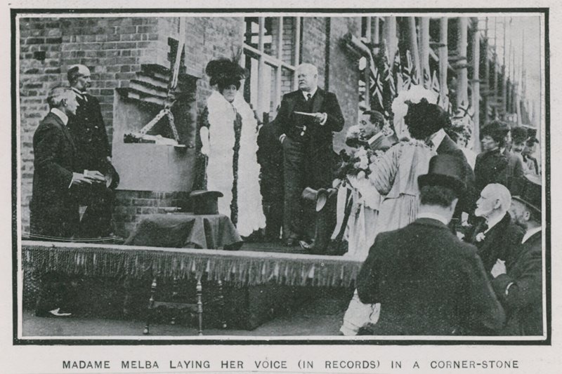 Madame Melba laying her voice on record in a corner-stone by English Photographer