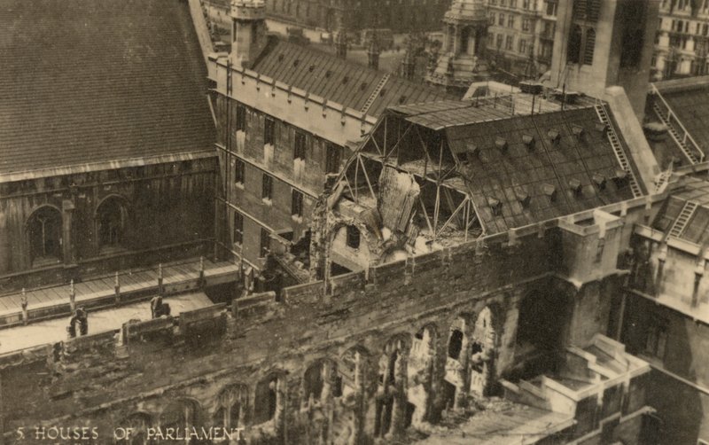 The Houses of Parliament, London, showing bomb damage during WW2 by English Photographer