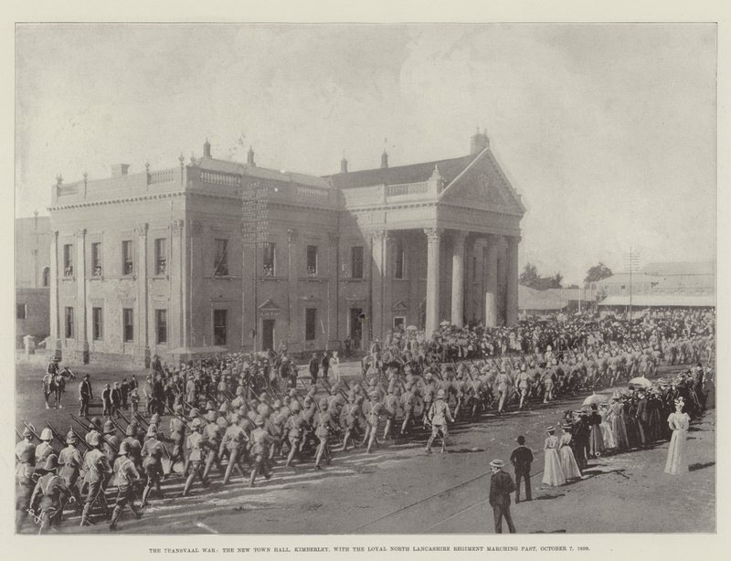 The Transvaal War, The New Town Hall, Kimberley, with the Loyal North Lancashire Regiment Marching Past, 7 October 1899 by English Photographer