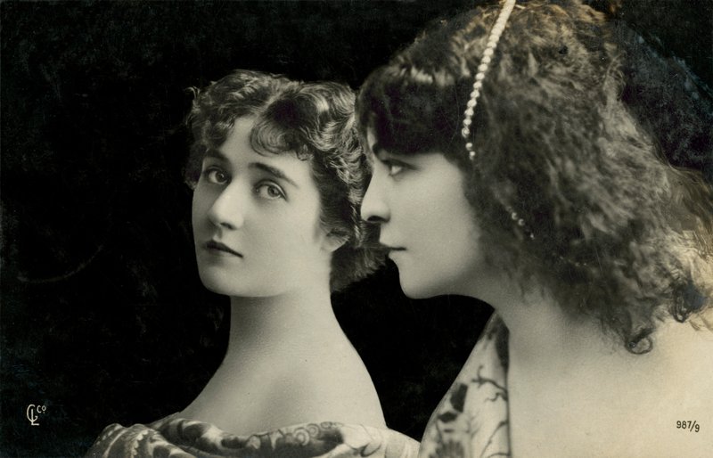 Two women pose by English Photographer