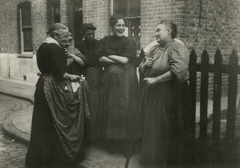 Women Talking in the Street, London by English Photographer