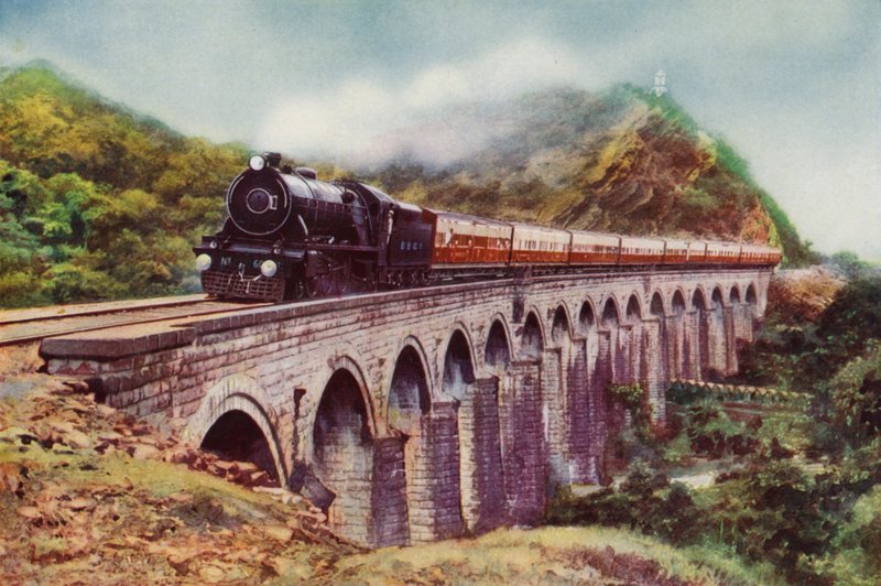 4-6-2 steam locomotive of the Bombay, Baroda and Central India Railway hauling the Frontier Mail passing over a viaduct between Bombay and Delhi by English School