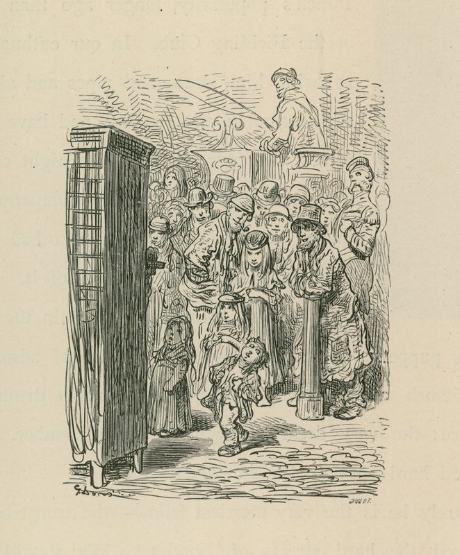 A crowd gather to watch a street entertainer