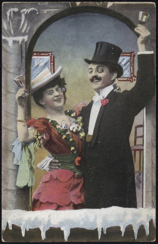 A well-dressed couple laughing by English School