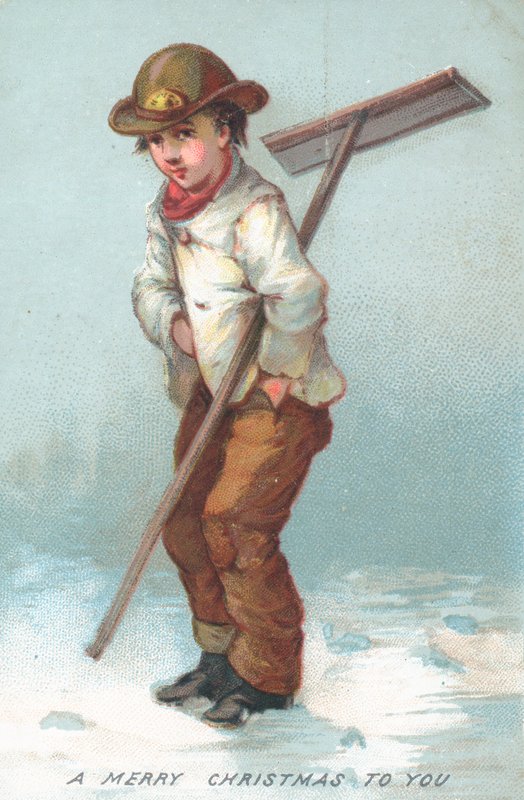 Boy clearing away snow by English School