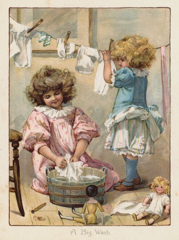 Two little girls washing their dolls
