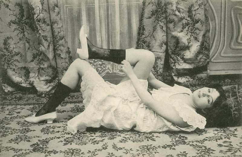 Girl pulling up her socks by French Photographer