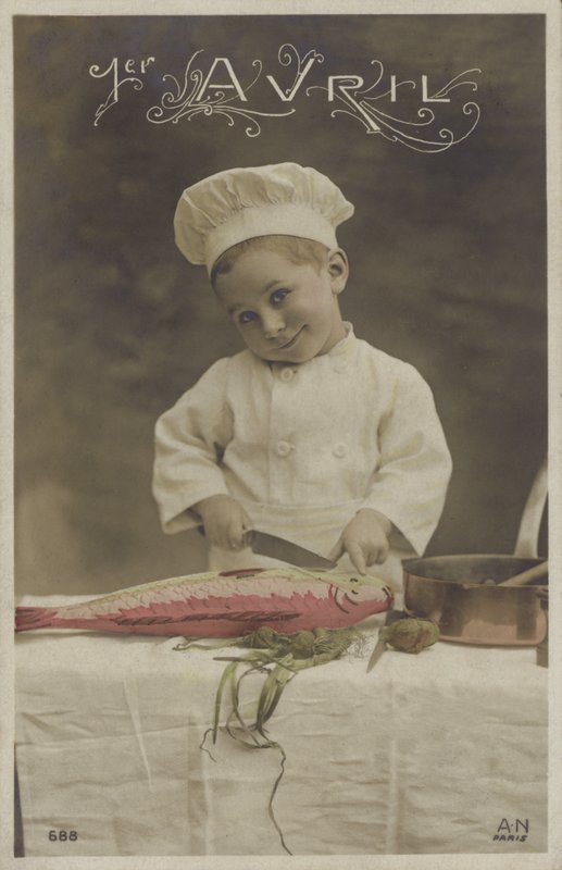 Little boy cooking a fish by French Photographer