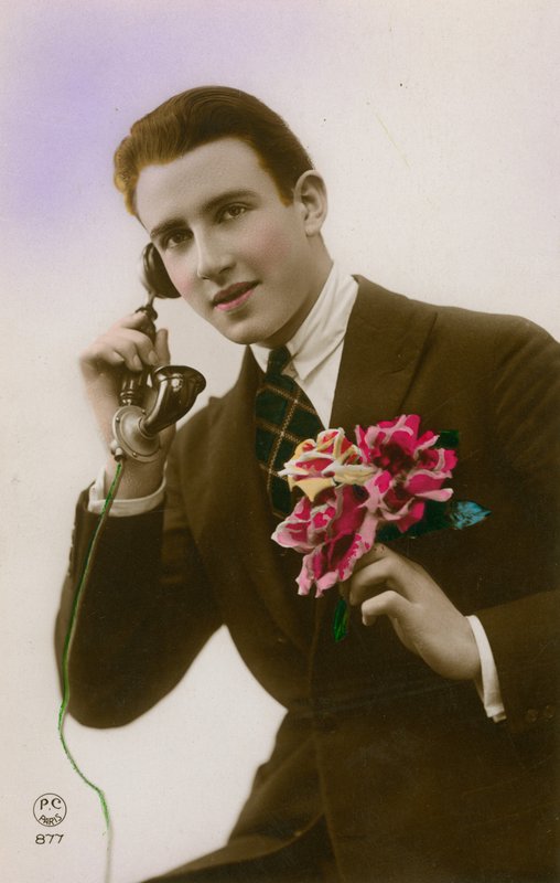 Man on the telephone, holding flowers by French Photographer