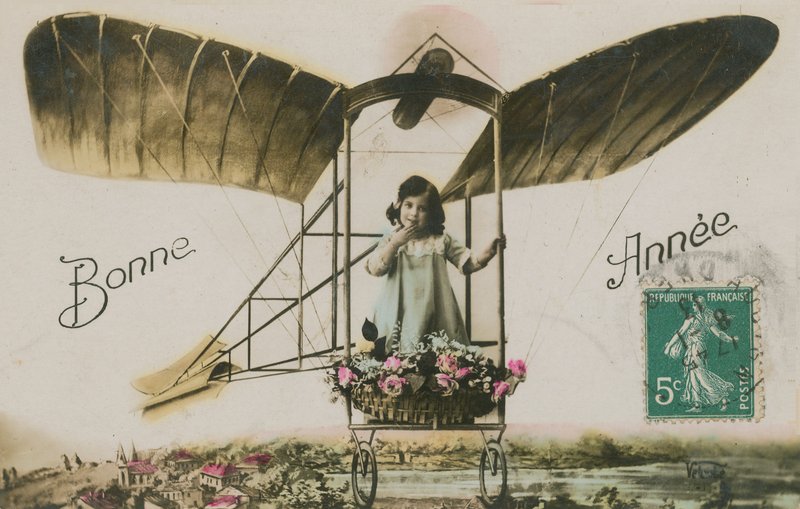 New Year greeting card of a girl in an aeroplane, 1913 by French Photographer