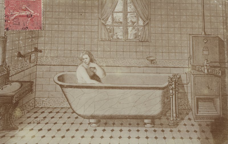 A woman in the bath in a bathroom by French School