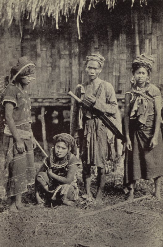 Burma: A Kachin man with the characteristic dah, and three women by Georges Bertin Scott