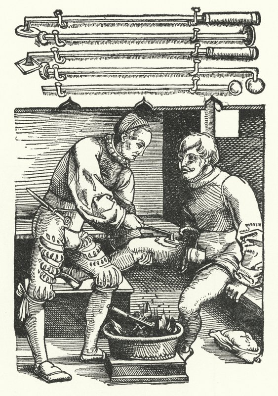 A surgeon cauterising a soldier