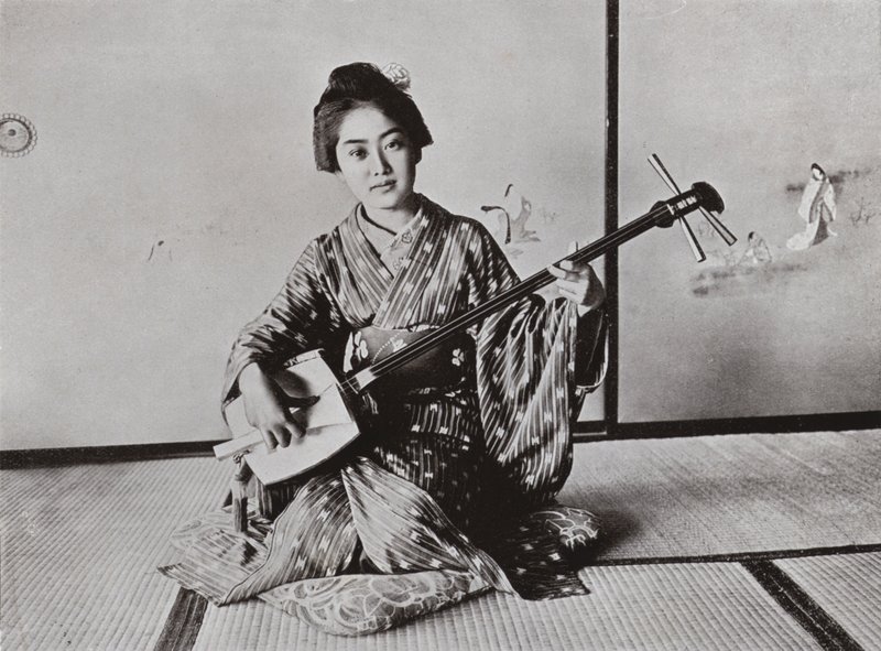 A Geisha playing the Samisen by Herbert Ponting