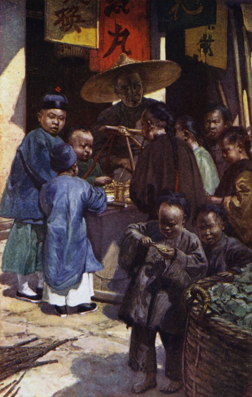 China: Boys round a sweet stall by Norman Hardy