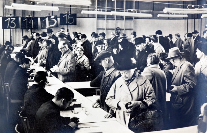 East German citizens queuing to obtain permits to visit relatives in the West by Photographer German