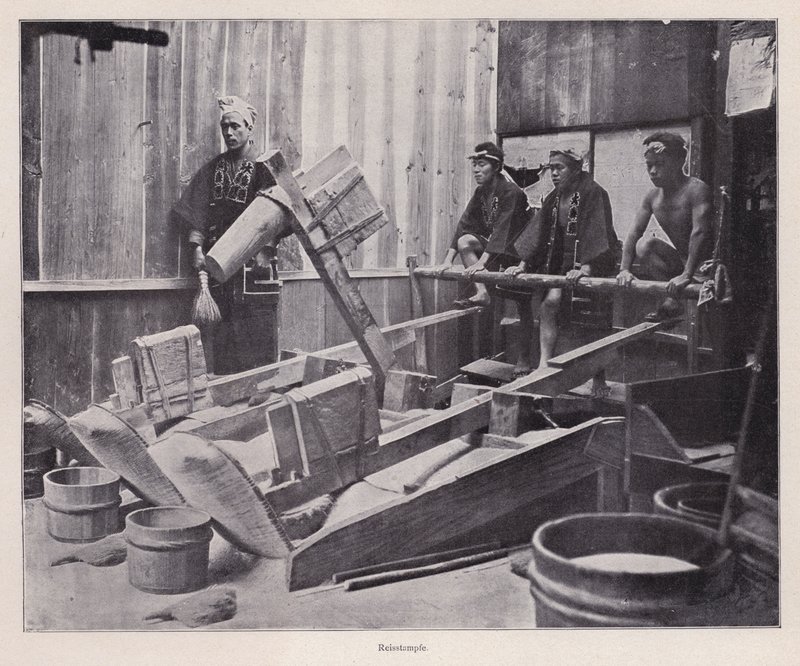 Dehulling rice or making rice flour using a rice pounder, Japan by Photographer Japanese