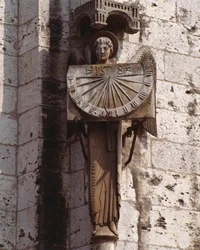 Gothic Art: Representation of the Angel on the Dial, Sculpture of the 20th century after an original of the 16th century preserved in the crypt, south-west corner of the Basilica Notre Dame de Chartres
