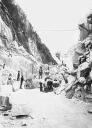 Excavators at work at a marble quarry in the Apuan Alps, Tuscany