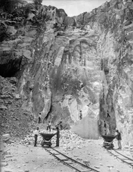 Excavators at work at a marble quarry in the Apuan Alps, in Tuscany (b/w photo)