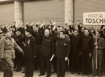 The construction workers of the Company Mauro Toschi fu Ulisse salute the Duce Benito Mussolini during the inauguration of the buildings of the Royal Airport "Fausto Fish" in Bologna, 24/10/1936